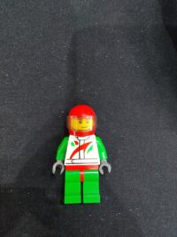 Race Car Driver, White Racing Suit with Octan Logo, Red Helmet with Trans-Brown Visor, Crooked Smile with Brown Dimple
